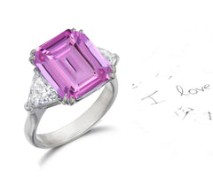 158 custom made unique emerald cut pink sapphire center stone and trillion cut diamond accents three stone engagement ring