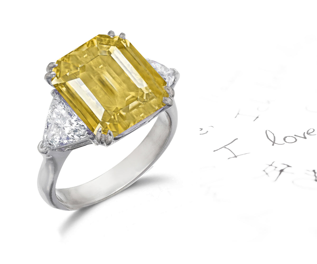 158 custom made unique emerald cut yellow sapphire center stone and trillion cut diamond accents three stone engagement ring