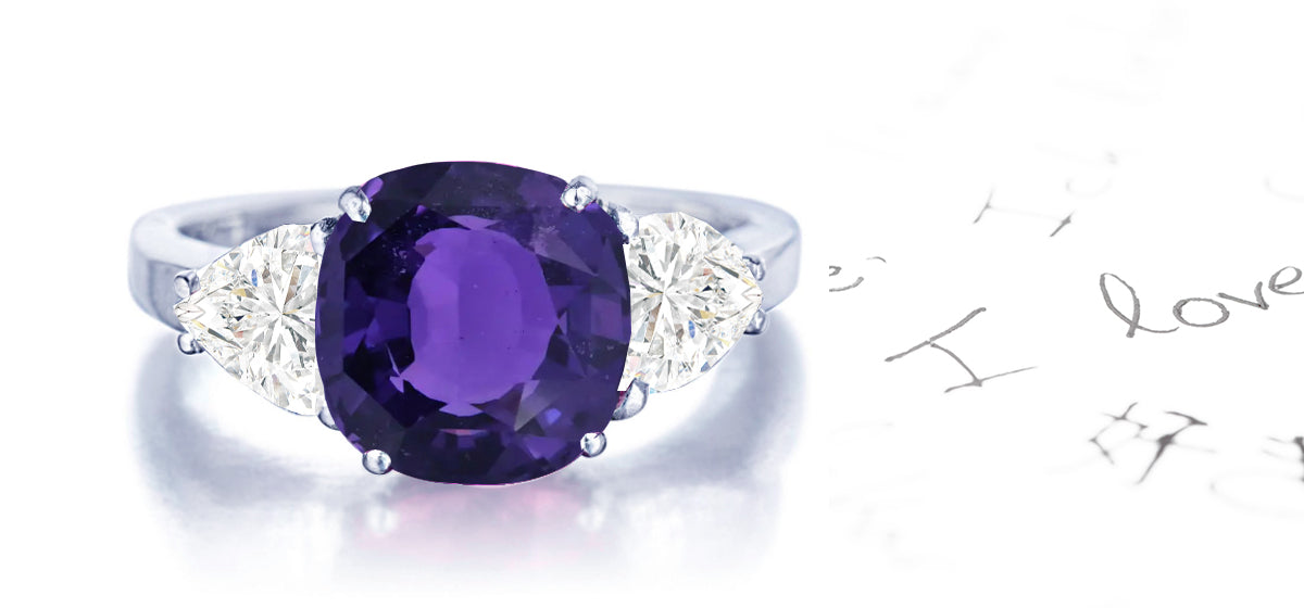 159 custom made unique round purple sapphire center stone and heartt diamond accents three stone engagement ring