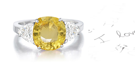 159 custom made unique round yellow sapphire center stone and heart diamond accents three stone engagement ring