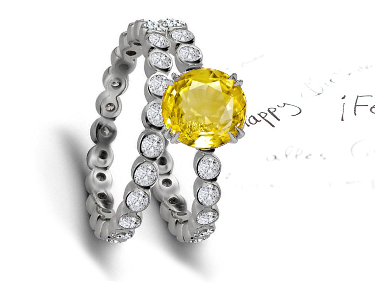 engagement ring with round yellow sapphire center and wedding band with round yellow sapphires and diamonds