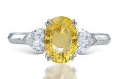 16 custom made unique oval yellow sapphire center stone with heart diamond accents three stone engagement ring