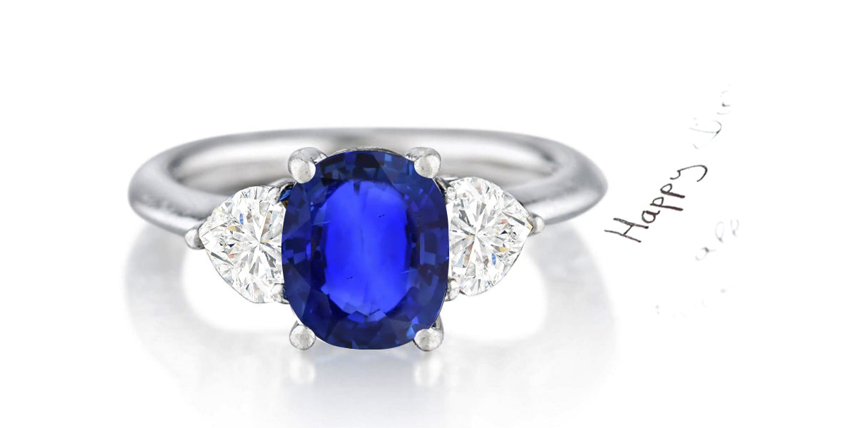 162 custom made unique oval blue sapphire center stone and heart diamond accents three stone engagement ring