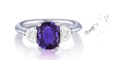 162 custom made unique oval purple sapphire center stone and heart diamond accents three stone engagement ring