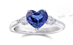 164 custom made unique heart blue sapphire center stone and pear diamond accents three stone engagement ring