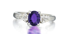 168 custom made unique oval purple sapphire center stone and pear diamond accents three stone engagement ring