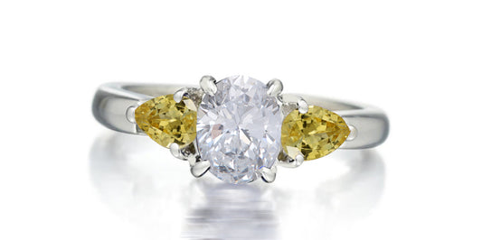 169 custom made unique oval diamond center stone and pear yellow sapphire accents three stone engagement ring