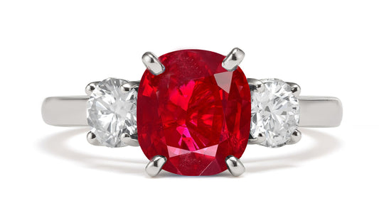 182 custom made unique oval ruby center stone and round diamond accents three stone engagement ring