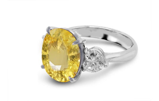 184 custom made unique oval yellow sapphire center stone and heart diamond accents three stone engagement ring