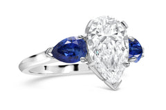 192 custom made unique pear shaped diamond center stone and pear blue sapphire accents three stone engagement ring