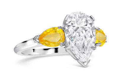 192 custom made unique pear shaped diamond center stone and pear yellow sapphire accents three stone engagement ring