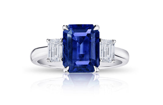 193 custom made unique emerald cut blue sapphire center stone and emerald cut diamond accents three stone engagement ring