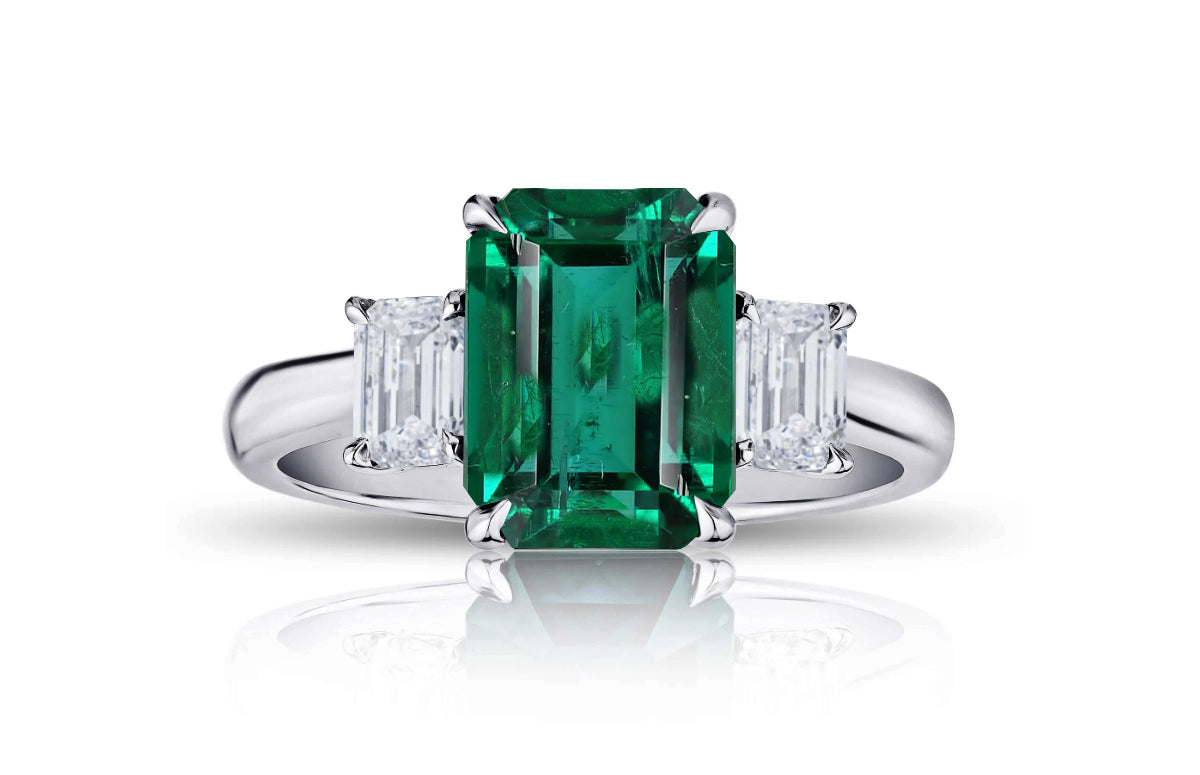 193 custom made unique emerald cut emerald center stone and emerald cut diamond accents three stone engagement ring