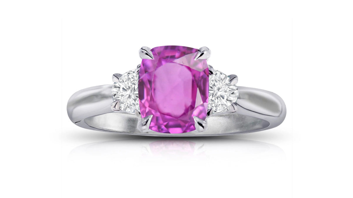 195 custom made unique oval pink sapphire center stone and heart diamond accents three stone engagement ring