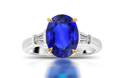 198 custom made unique oval blue sapphire center stone and baguette cut diamond accents three stone engagement ring