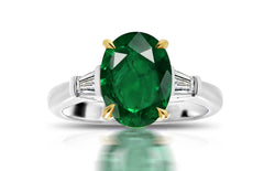 198 custom made unique oval emerald center stone and baguette cut diamond accents three stone engagement ring