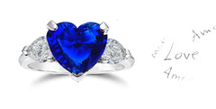 199 custom made unique heart blue sapphire center stone and pear shaped diamond accents three stone engagement ring