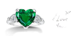 199 custom made unique heart emerald center stone and pear shaped diamond accents three stone engagement ring