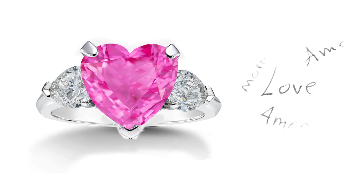 199 custom made unique heart pink sapphire center stone and pear shaped diamond accents three stone engagement ring