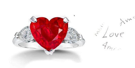 199 custom made unique heart ruby center stone and pear shaped diamond accents three stone engagement ring