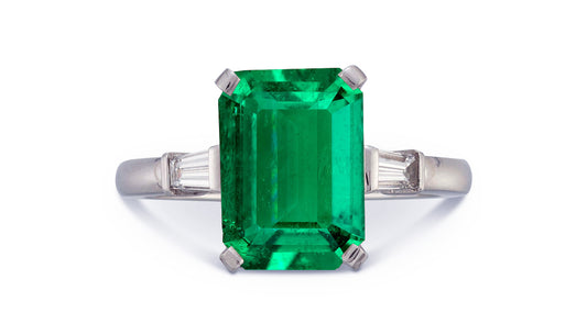 19 custom made unique emerald cut emerald center stone with baguette diamond accents three stone engagement ring