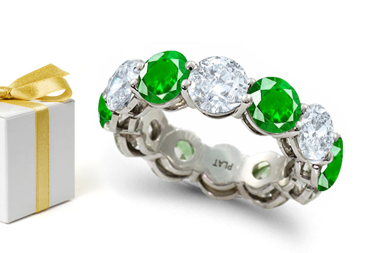 eternity ring prong set with round emeralds and diamonds