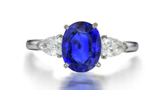 201 custom made unique oval blue sapphire center stone and pear shaped diamond accents three stone engagement ring1