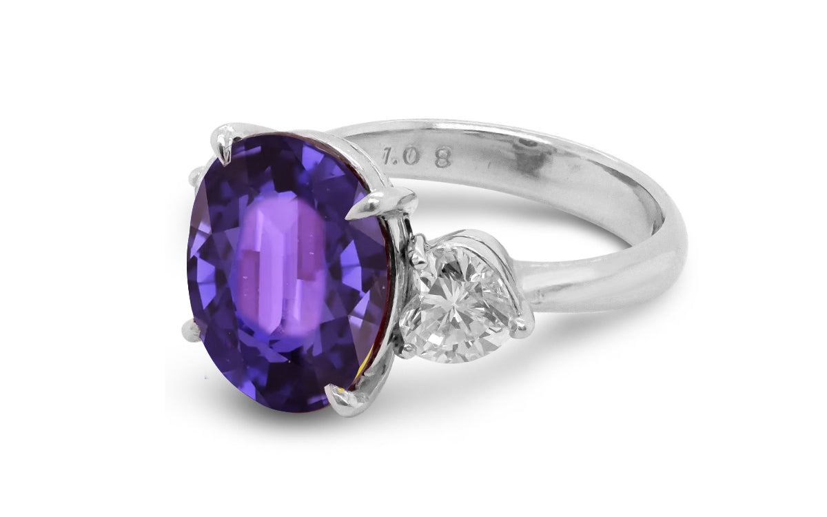 209 custom made unique oval cut purple sapphire center stone and heart diamond side three stone engagement ring