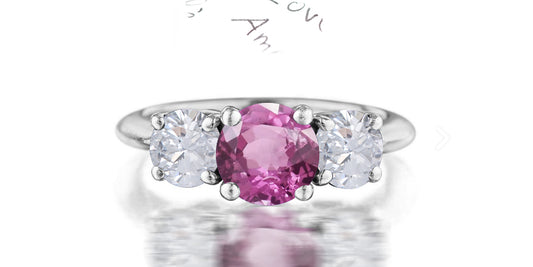 211 custom made unique round cut pink sapphire center stone and round diamond side three stone engagement ring