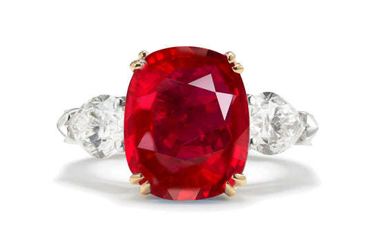 217 custom made unique oval ruby center stone and pear diamond side three stone engagement ring