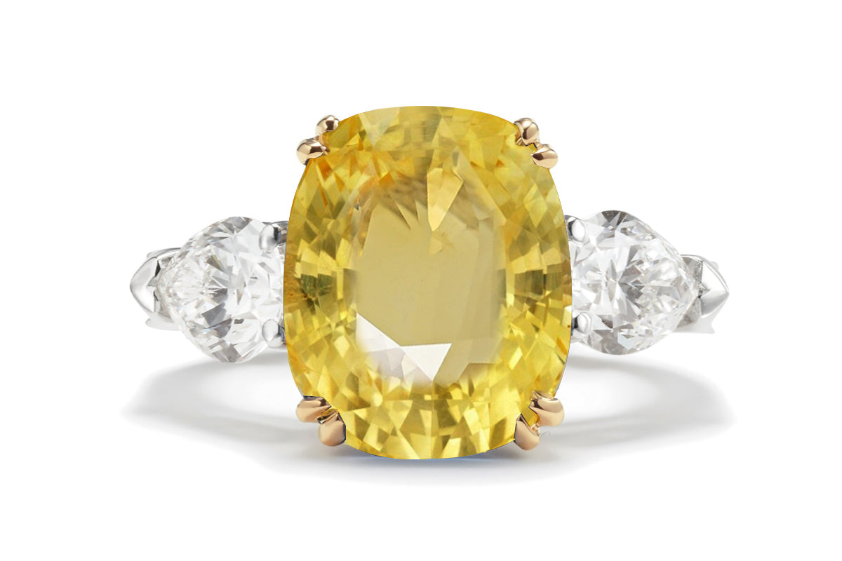 217 custom made unique oval yellow sapphire center stone and pear diamond side three stone engagement ring