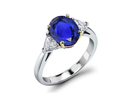 218 custom made unique oval blue sapphire center stone and trillion diamond side three stone engagement ring