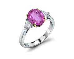 218 custom made unique oval pink sapphire center stone and trillion diamond side three stone engagement ring