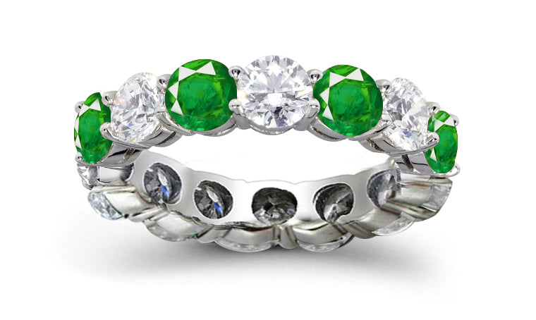 eternity ring prong set with round emeralds and diamonds