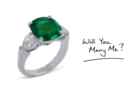 23 custom made unique cushion cut emerald center stone with pear diamond accents three stone engagement ring