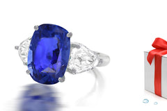 232 custom made unique oval blue sapphire center stone and fanct diamond side three stone engagement ring