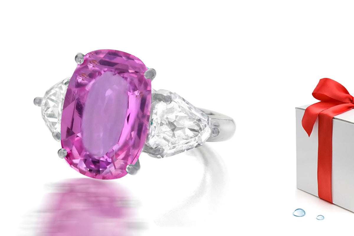 232 custom made unique oval pink sapphire center stone and fancy diamond side three stone engagement ring