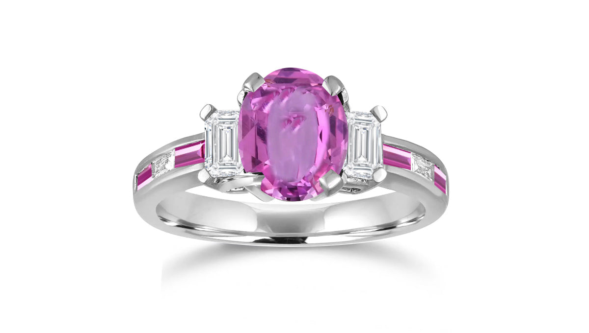 240 custom made unique oval pink sapphire center stone and baguette pink sapphire diamond side engagement ring