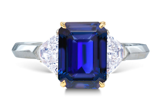 25 custom made unique emerald cut blue sapphire center stone with trillion diamond accents three stone engagement ring