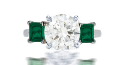 253 custom made unique round diamond center stone and square emerald accent three stone engagement ring