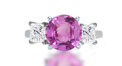 255 custom made unique round pink sapphire center stone and square diamond accent three stone engagement ring1