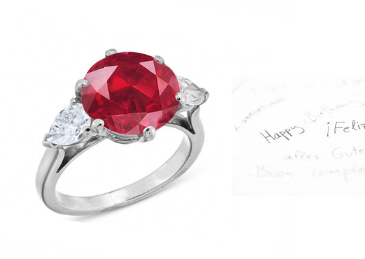 26 custom made unique round ruby center stone with pear diamond accents three stone engagement ring