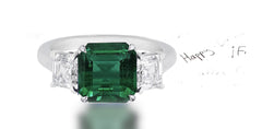 265 custom made unique asscher cut emerald center stone and asscher cut diamond accent three stone engagement ring