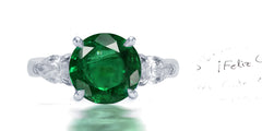 267 custom made unique round emerald center stone and pear diamond accent three stone engagement ring