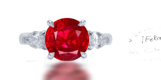 267 custom made unique round ruby center stone and pear diamond accent three stone engagement ring