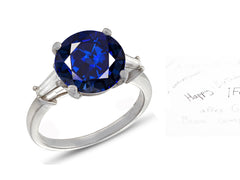 27 custom made unique round blue sapphire center stone with baguette diamond accents three stone engagement ring