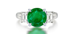 272 custom made unique round emerald center stone and emerald cut diamond accent three stone engagement ring