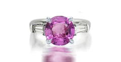 273 custom made unique round pink sapphire center stone and baguette cut diamond accent three stone engagement ring