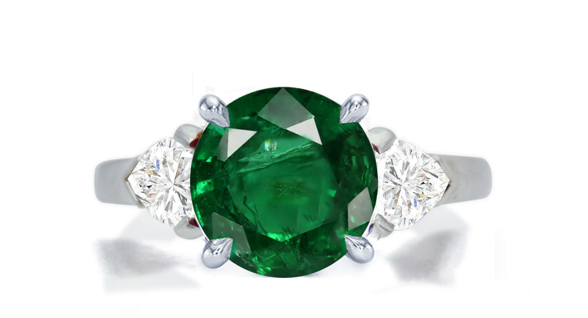 276 custom made unique round emerald center stone and heart diamond accent three stone engagement ring