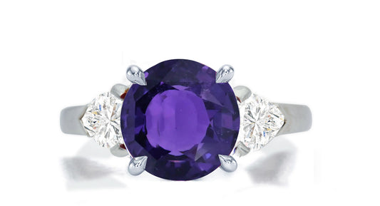 276 custom made unique round purple sapphire center stone and heart diamond accent three stone engagement ring